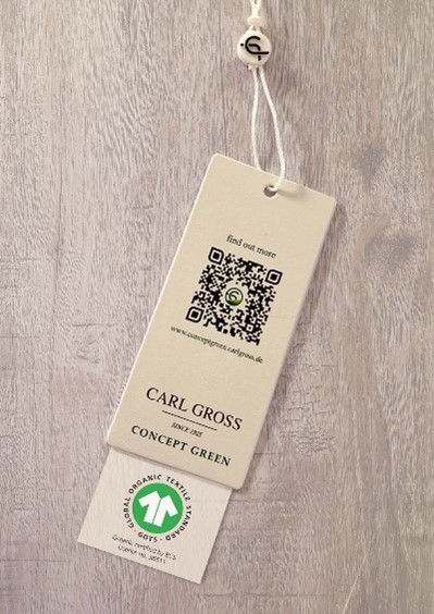 Photo of CARL GROSS Concept Green Hangtag including QR code and GOTS logo