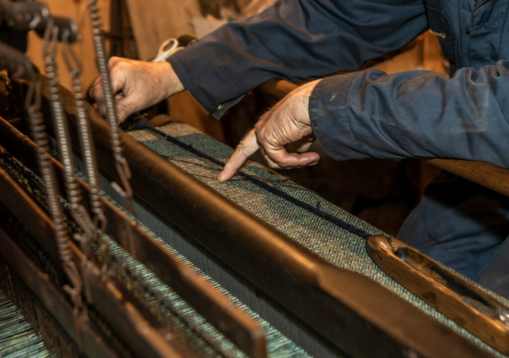 You can see a loom on which Harris Tweed is being woven.